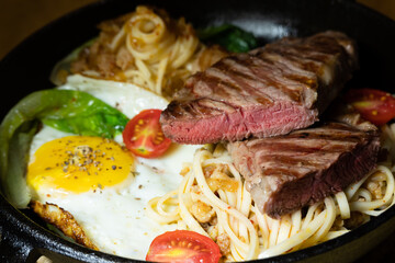 sliced steak with fried noodles