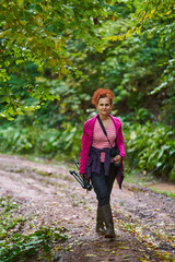 Nature photographer lady on a hiking trail