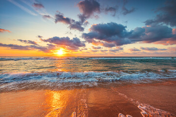Beautiful sunrise over the sea waves and beach on tropical island beach - obrazy, fototapety, plakaty
