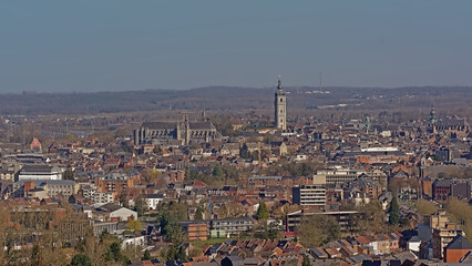 Aerial view onthe city of Mons, with  Saint Waltrude Collegiate Church and medieval townhouse. Hainaut, Belgium, iew from terril de l`heribus hill  - obrazy, fototapety, plakaty