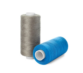Different colorful sewing threads on white background