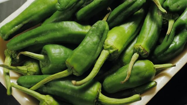Traditional Spanish patron peppers, green padrons tapas.