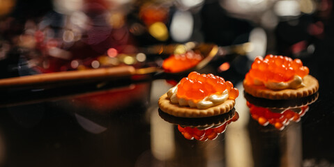 Salmon Red Caviar. Delicious snacks cracker, butter, salmon red caviar. Raw seafood. Luxury delicacy food. appetizer, selective focus, place for text