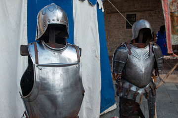 Historical re-enactments medieval weapons and armor appearing in medieval clothes