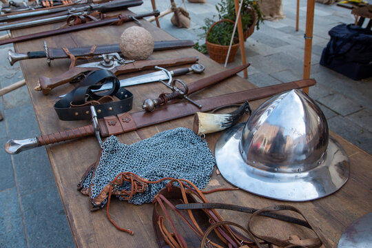 Historical re-enactments medieval weapons and armor appearing in medieval clothes