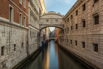 Fototapeta na wymiar Bridge of Sighs and Doge's Palace in Venice, Italy. Long exposure to smooth out the water