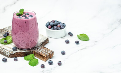 blueberry smoothie Yogurt fruit dessert on a light background. Berry smoothie. healthy dieting...