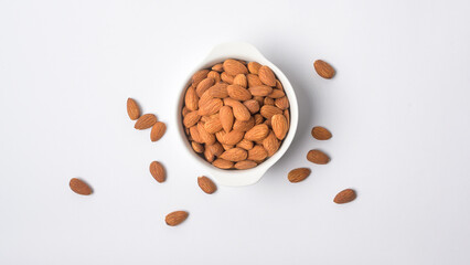 Obraz na płótnie Canvas Almond roasted in bowl on white background , Healthy food concept