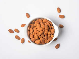 Almond roasted in bowl on white background , Healthy  food concept
