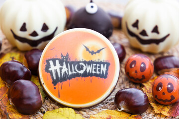 Halloween chocolate candies, white chocolate pumpkins and chestnuts.