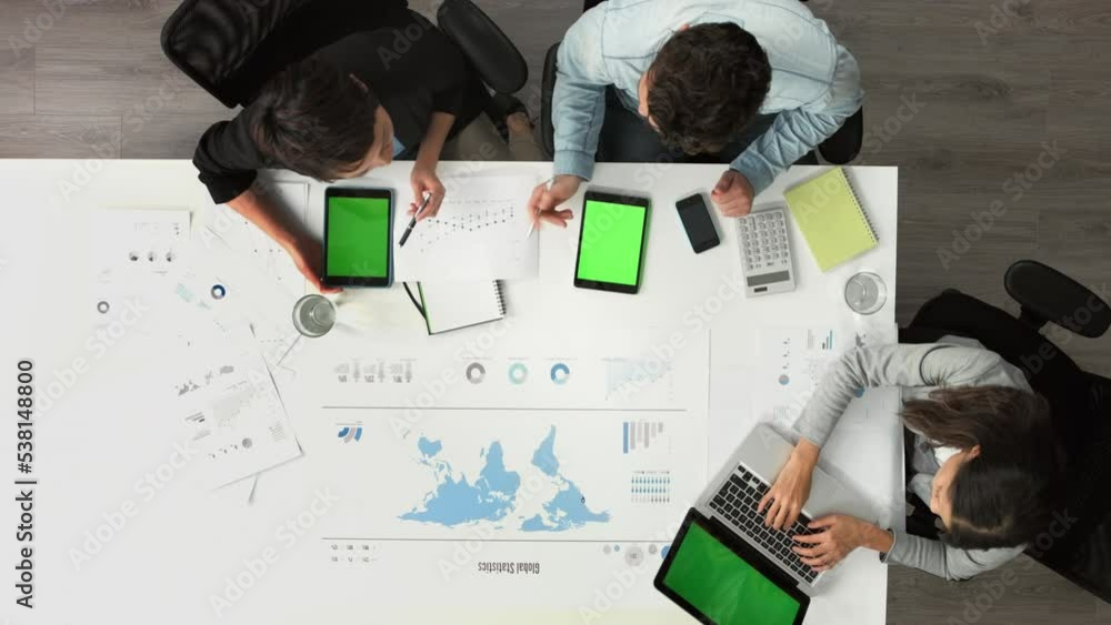 Aufkleber Chroma key, global tablet green screen and mockup space of technology in a business meeting. Busy corporate budget team above view of workers working on world tech data planning a teamwork project