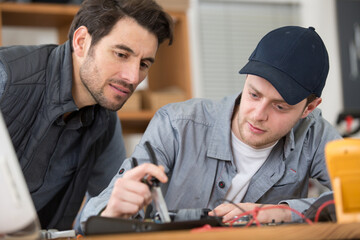 young student in technical vocational training with teacher