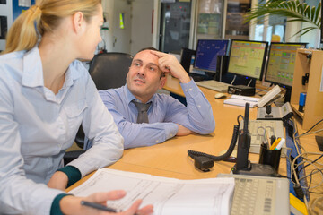 business man and woman on computers
