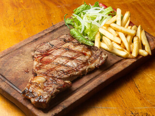 grilled steak with fries