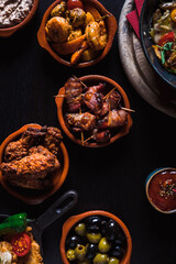 Flatlay of Tapas bowls arranged on a table in a Tapas Bar.
