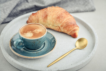 Croissant and a cup of coffee
