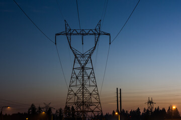 modern electric energy power grid at dusk night wide angle