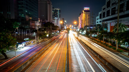 The light of cars running against each other with a low shutter shot in the middle of the capital Bangkok Thailand
