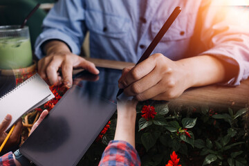 businesswoman hand working with laptop computer, tablet and smart phone in modern office with virtual icon diagram at modernoffice in morning light