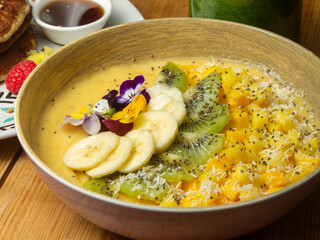 bowl with turmeric and fruit 