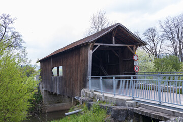 Fototapeta na wymiar Covered bridge over the Kocher river in Germany