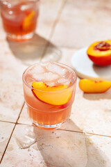 Iced peach tea with ice on a hot summer day