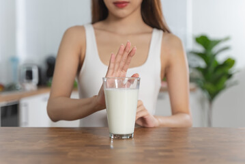 Obraz na płótnie Canvas person deny to drink milk because lactose tolerance