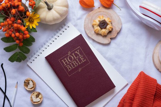 Holy Bible and autumn cozy decor top view. Bible study fall concept