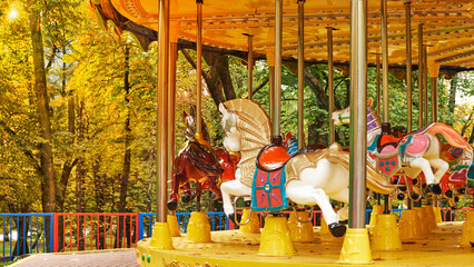 empty children's carousel in autumn city park