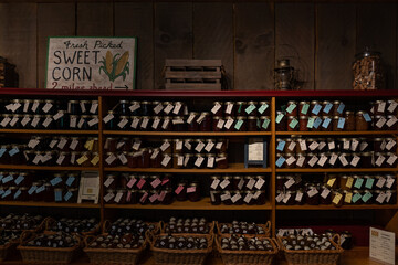 Various flavor fruit jams on wooden shelves. Homemade fresh preserve on farmer market