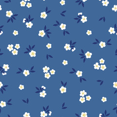 Fototapeta na wymiar seamless vintage pattern. small white flowers and dark blue leaves. blue background. vector texture. fashionable print for textiles and wallpaper.
