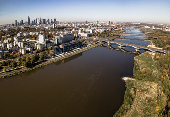 Aerial view on a sunny ,autumn day on the center of Warsaw ,skyscrapers ,financial centers and the Vistula River and bridges on it.