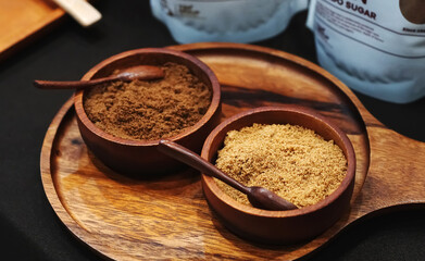 Brown sugar in a wooden cup, sugar for dessert. 