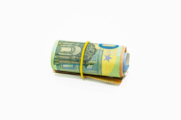 Roll of Euro notes in the elastic band. EU banknotes in a money roll