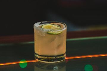 BAR COCKTAIL, REFRESHING MARGARITA ON A BAR COUNTER