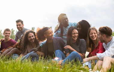 Group of happy friends having fun outdoor laughing together - Diversity and integration concept