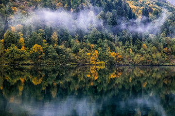 morning mist over mountain lake