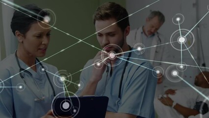 Animation of dots connected with lines over multiracial doctors discussing report over clipboard - Powered by Adobe