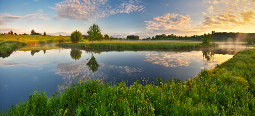 Beautiful spring sunrise over river bank. nature of Ukraine