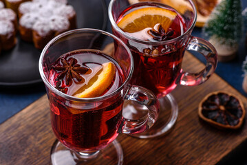 Hot mulled wine with a slice of orange, with cinnamon, cloves and other spices