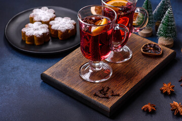 Hot mulled wine with a slice of orange, with cinnamon, cloves and other spices