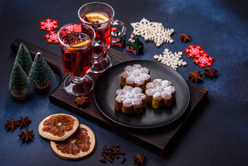 Hot mulled wine with a slice of orange, with cinnamon, cloves and other spices