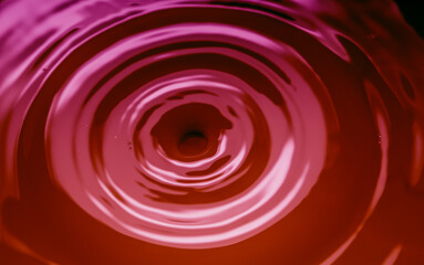 abstract background with circles on pink liquid