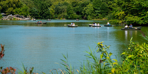 Central Park Lake. People are rowing boats