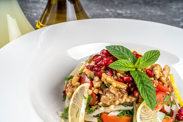 Gavurdağı Salad - Traditional Turkish Walnut Salad with Vegetables served with lemoon and salad dressings.