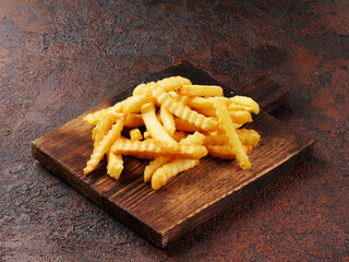 french fries on a wooden board