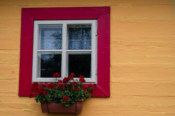 Fototapeta na wymiar wooden classic window in the old colorful wall