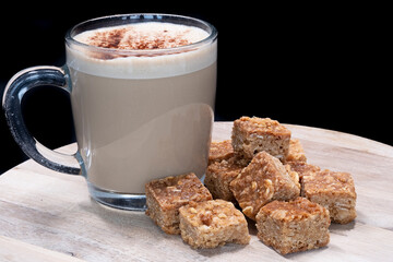 Ten oatmeal flapjacks and a mug of coffee.