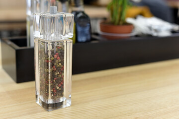 Spices in glass containers. A set of spices in a restaurant