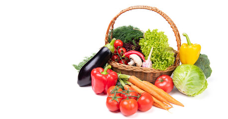 Still-life with fresh vegetables in basket isolated on white, copy space